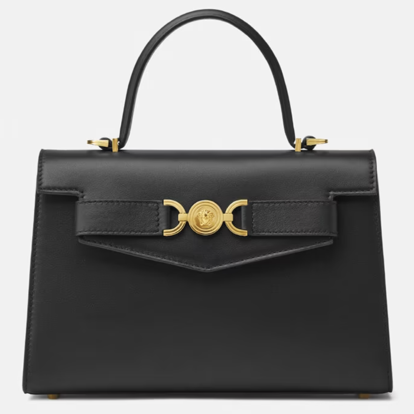 An elegant black designer handbag with gold hardware accents, featuring a prominent front clasp.
